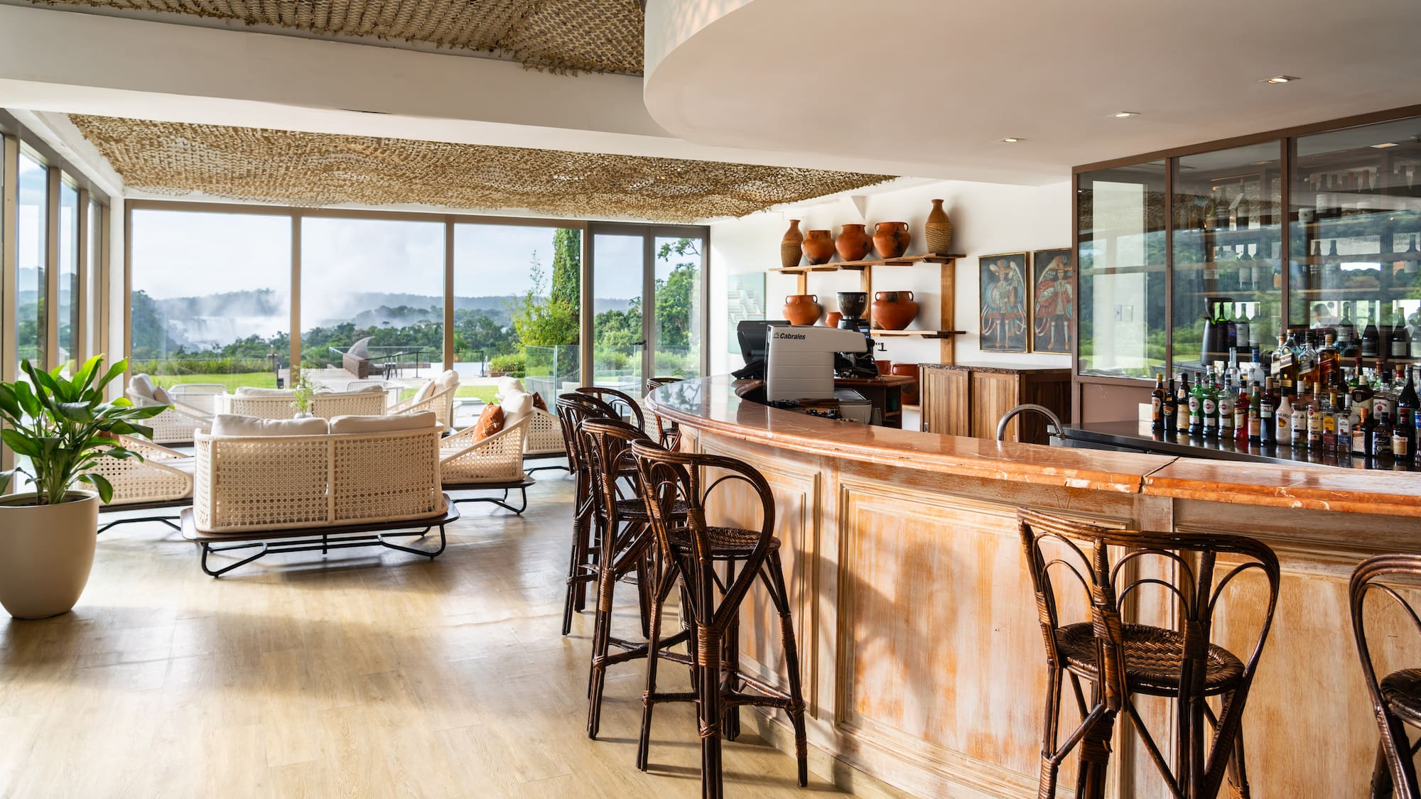 a room with a bar and chairs