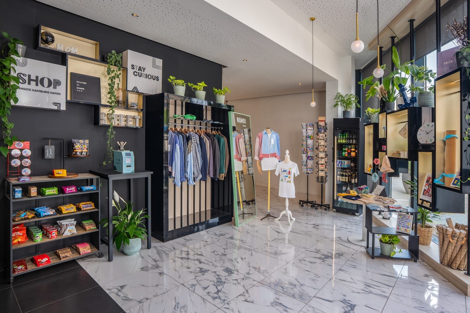 a store with a variety of clothes on swingers