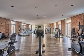 a large room with exercise equipment
