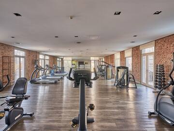 a large room with exercise equipment
