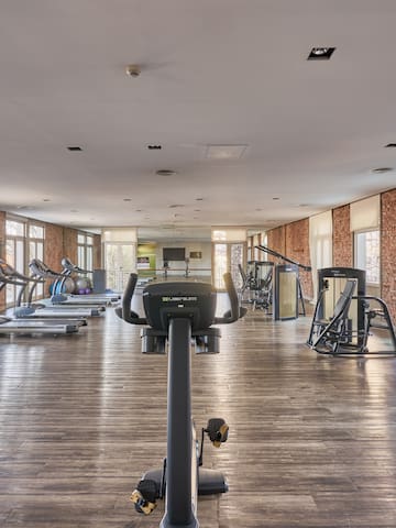 a large room with exercise equipment