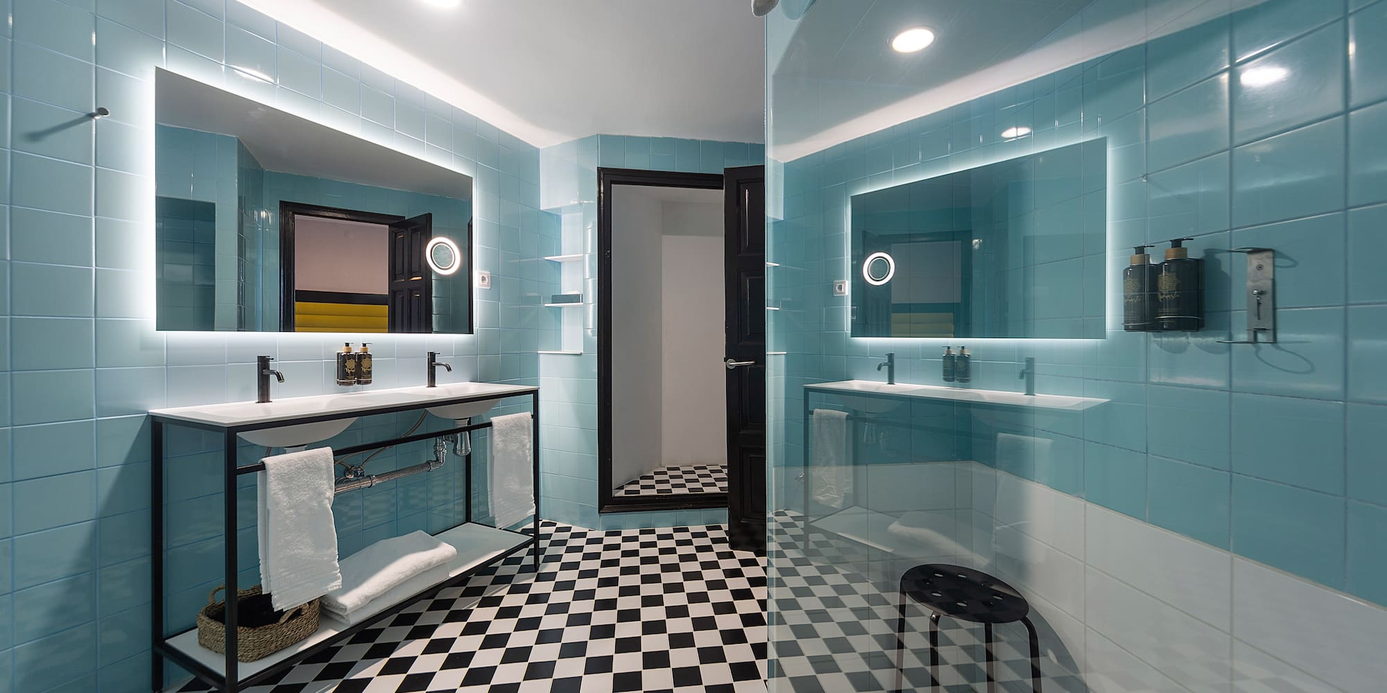 a bathroom with a mirror and a shower