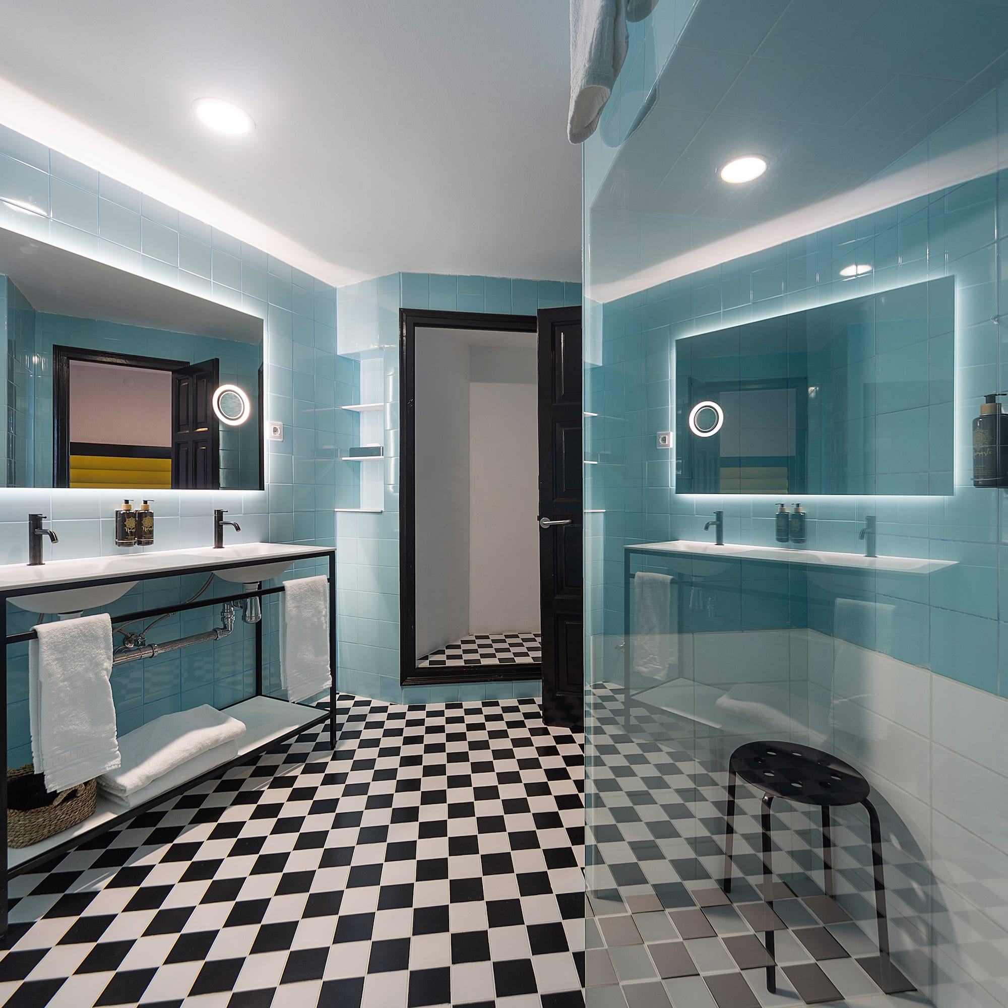 a bathroom with a mirror and a shower