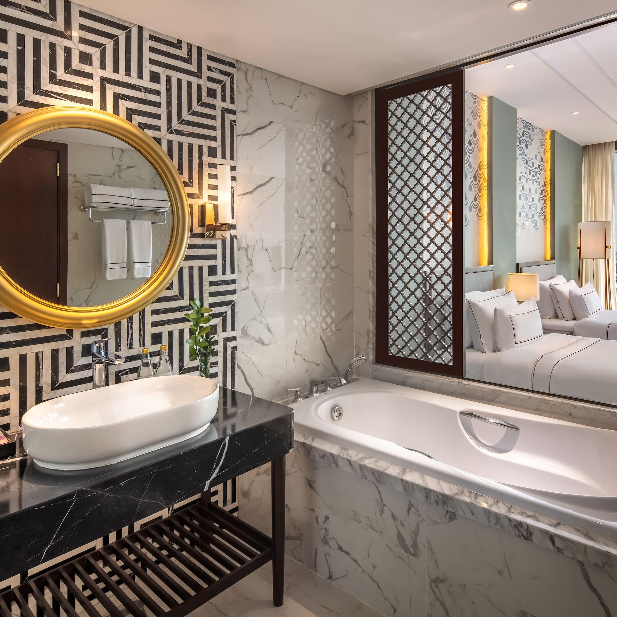 a bathroom with a mirror and a tub