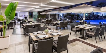 a restaurant with tables and chairs