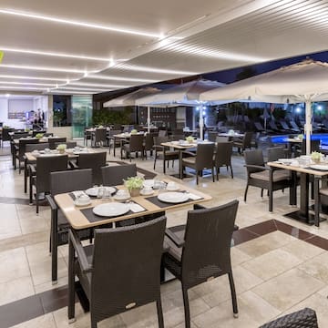 a restaurant with tables and chairs