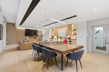 a room with a table and chairs