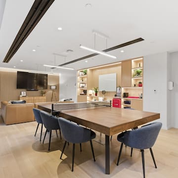 a room with a table and chairs