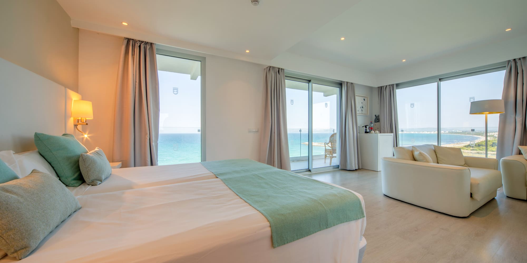 a bedroom with a large bed and a couch