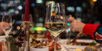 a table with food and wine glasses