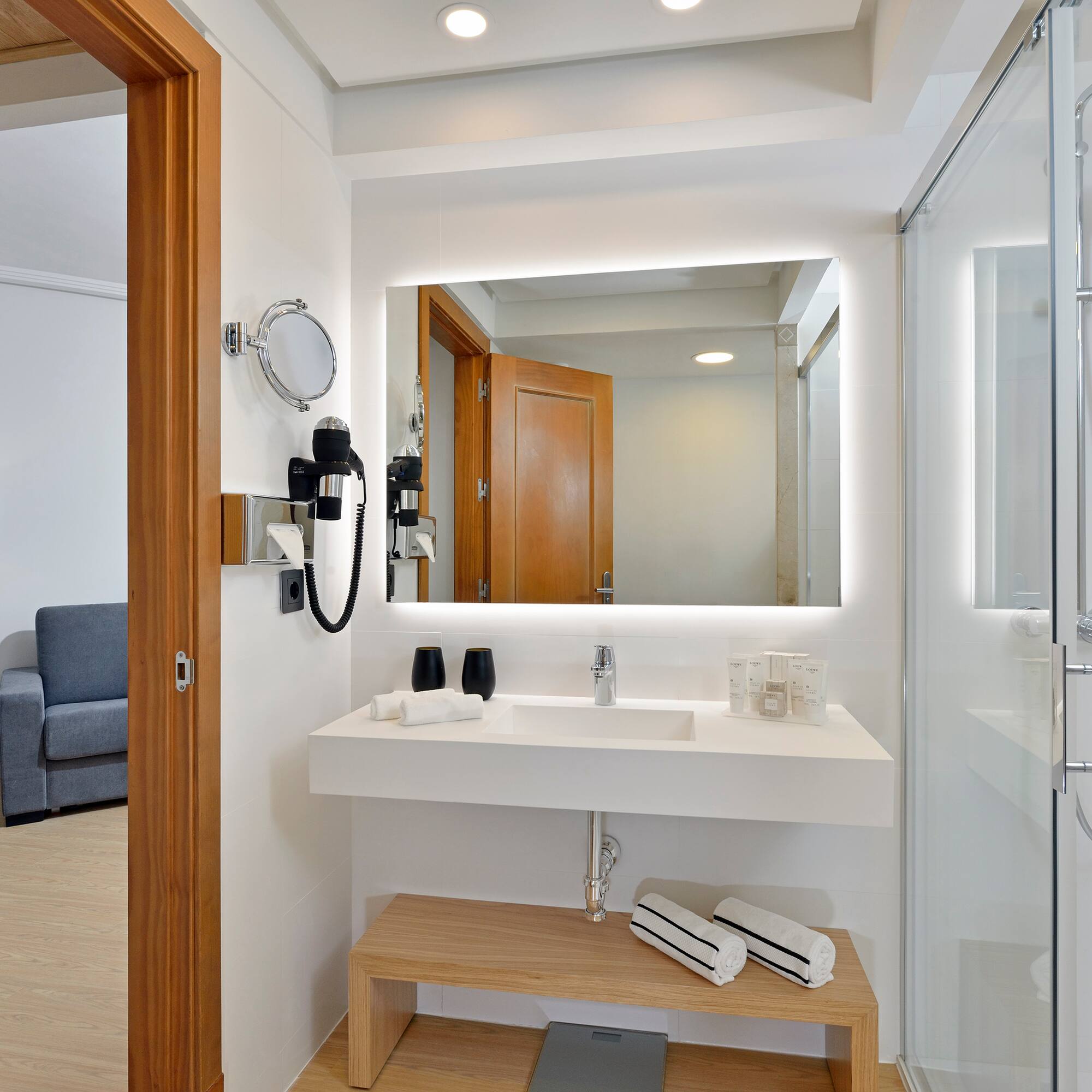 a bathroom with a mirror and a sink