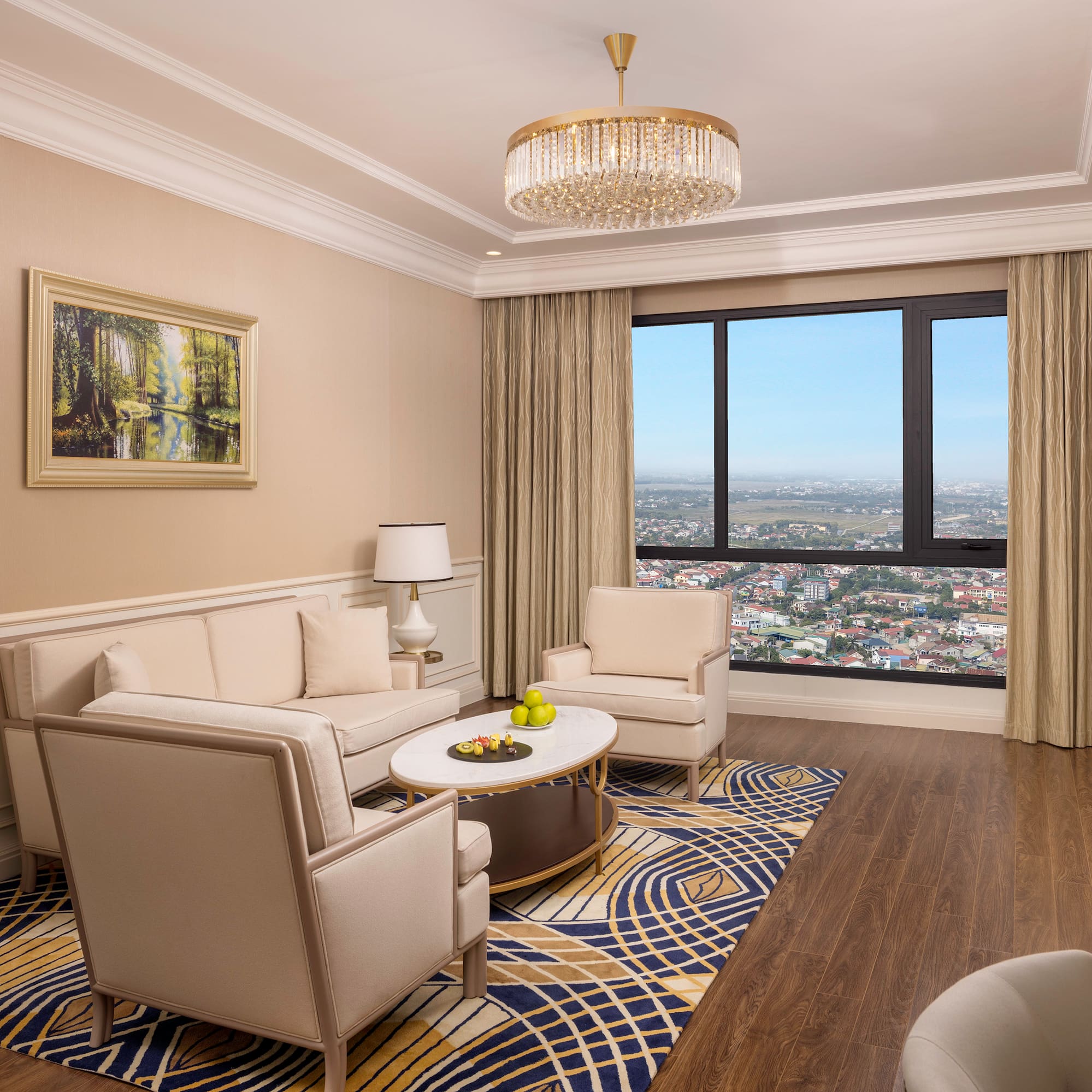 a living room with a large window and a couch and chairs