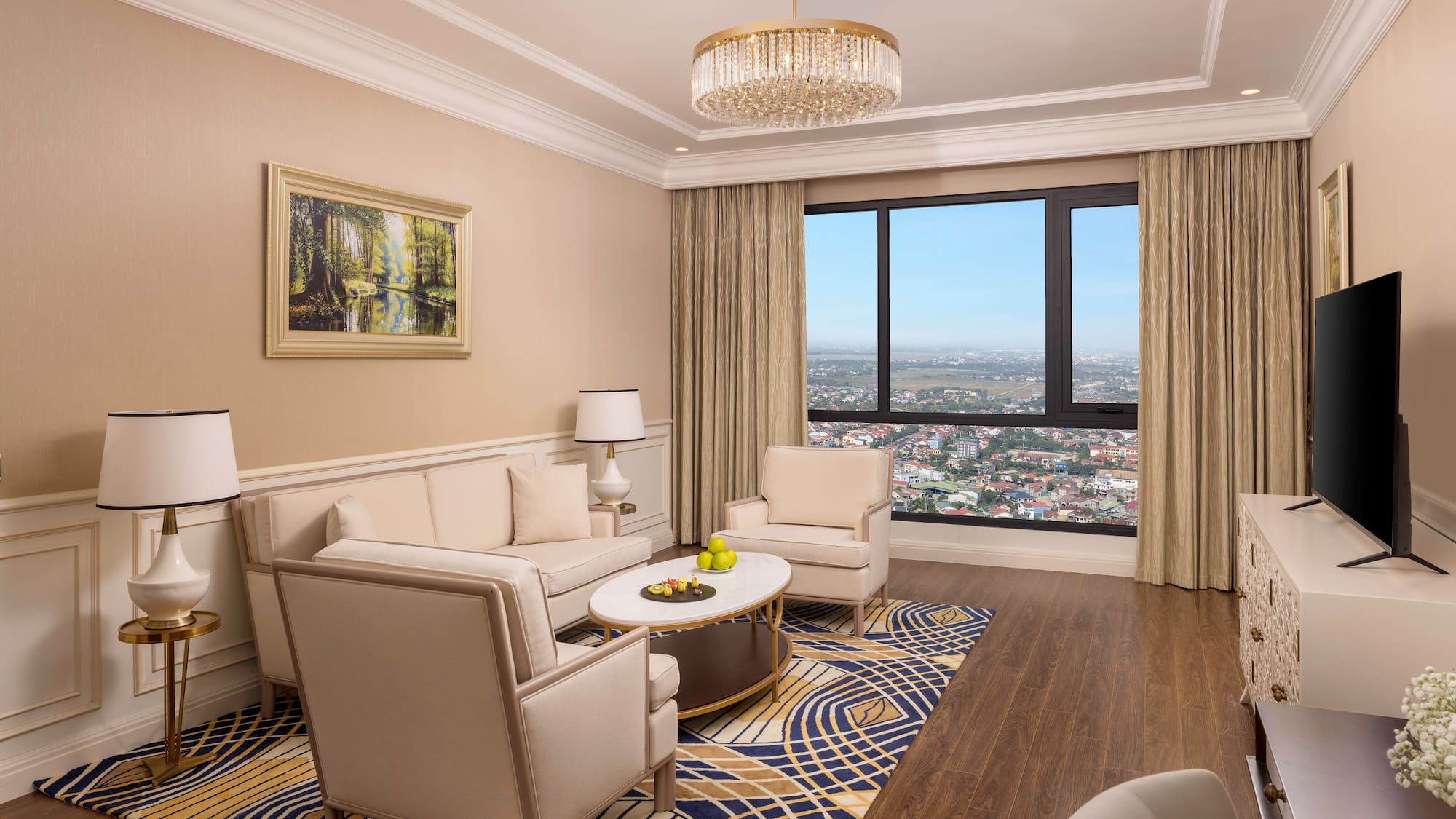 a living room with a large window and a couch and chairs