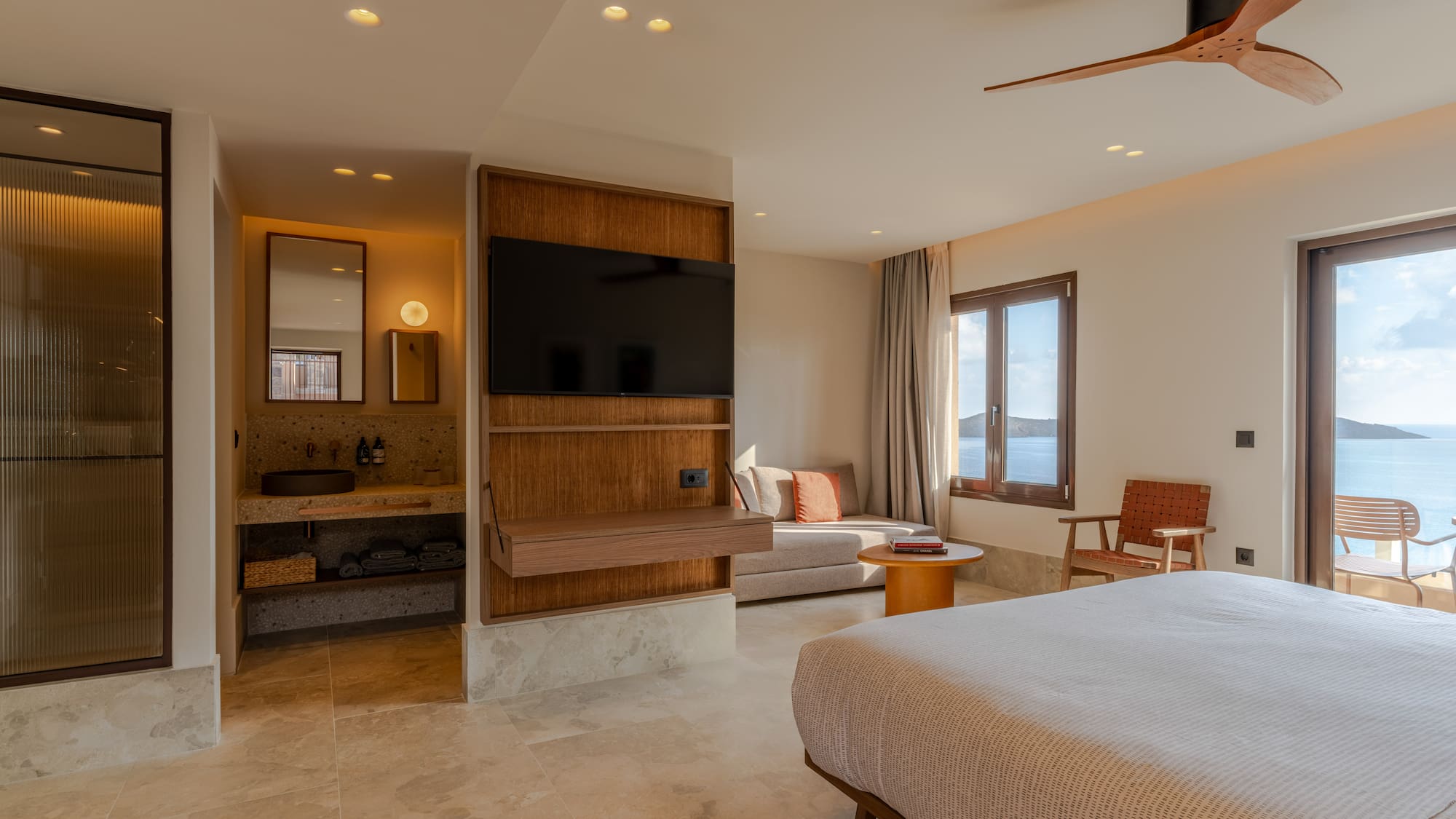 a room with a bed and a television