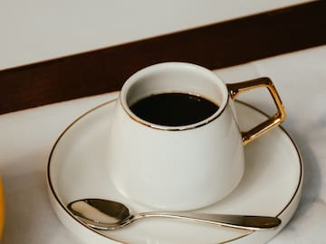 a cup of coffee on a saucer