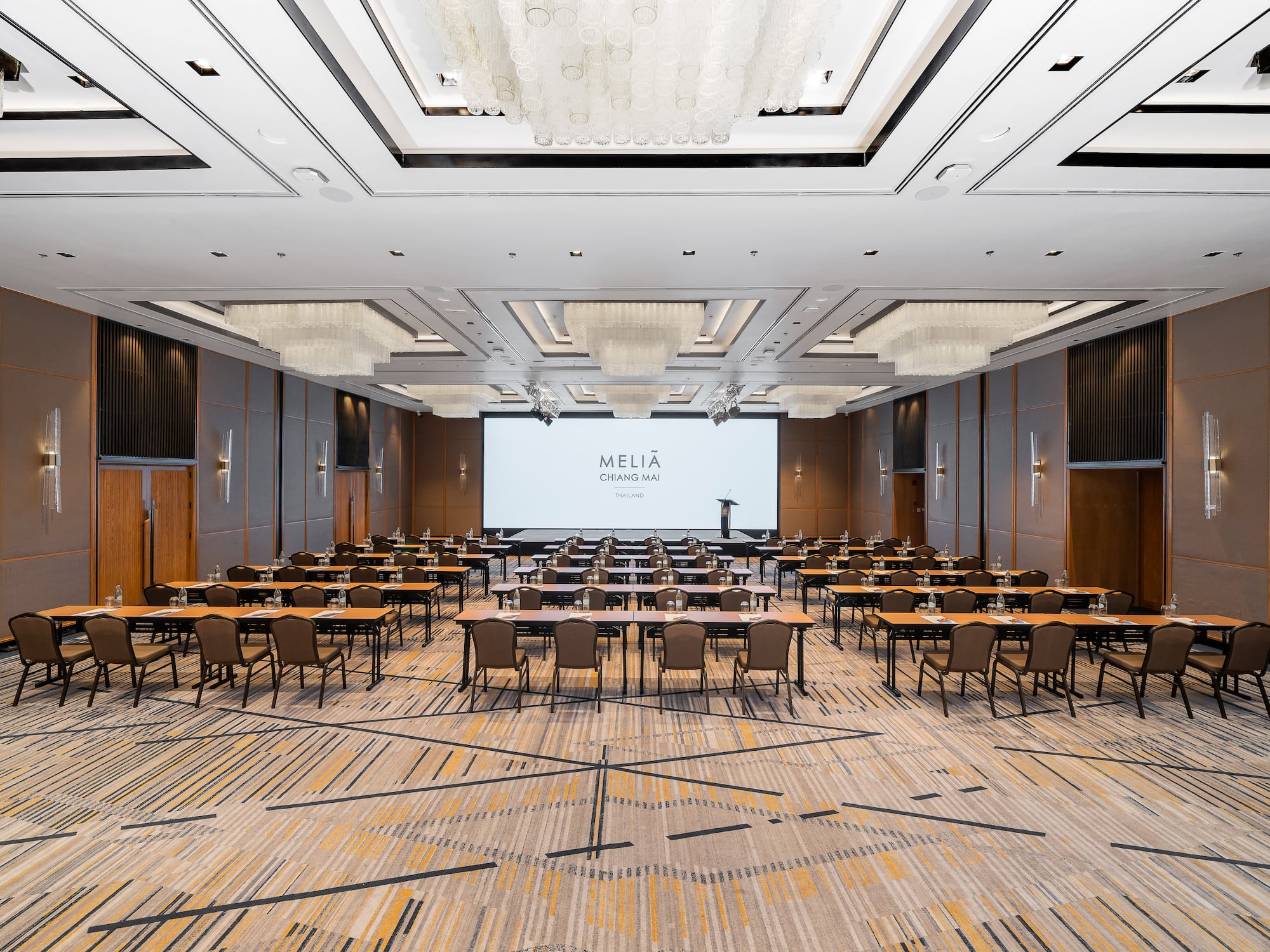 a room with tables and chairs..