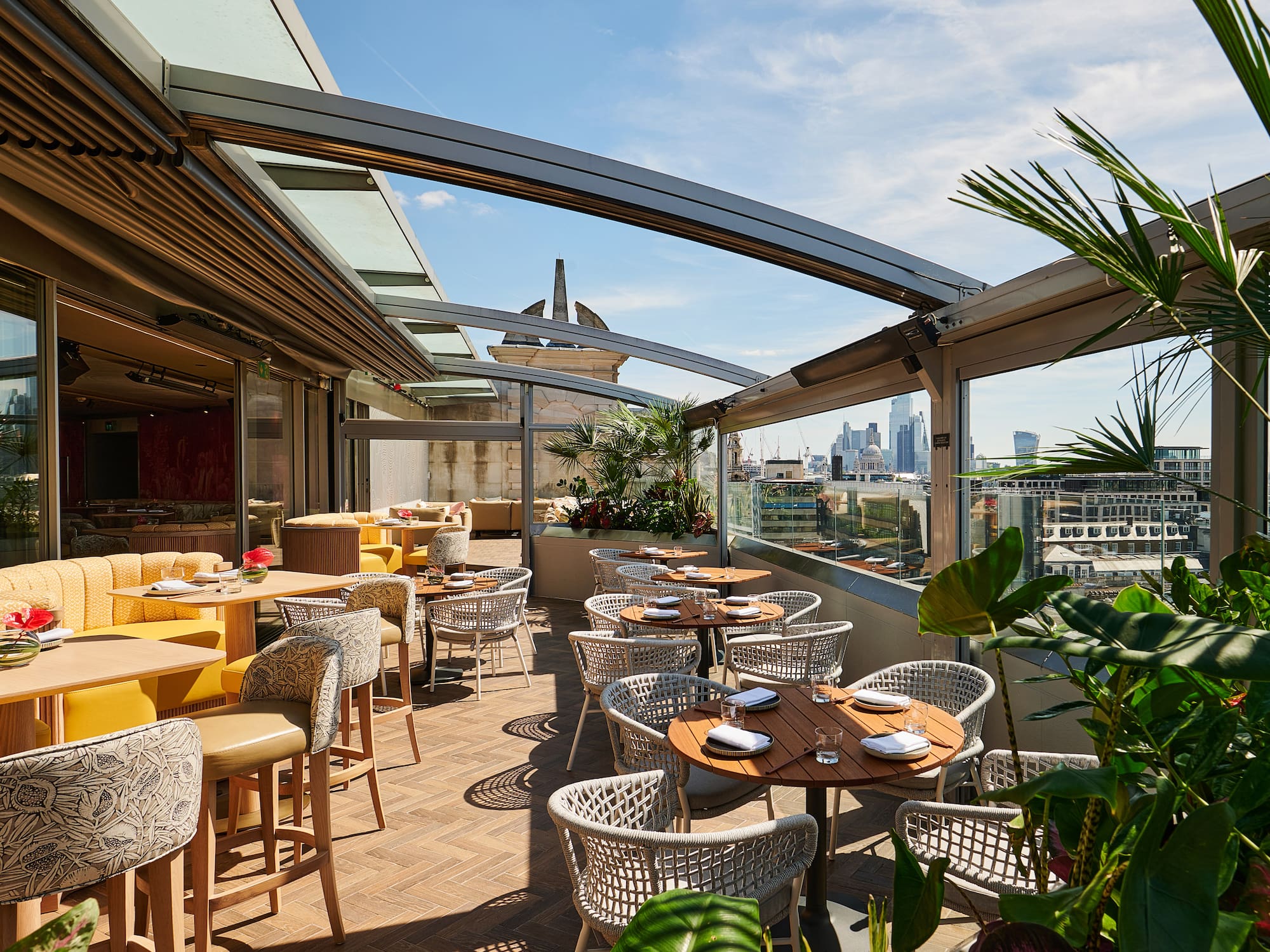 a patio with tables and chairs