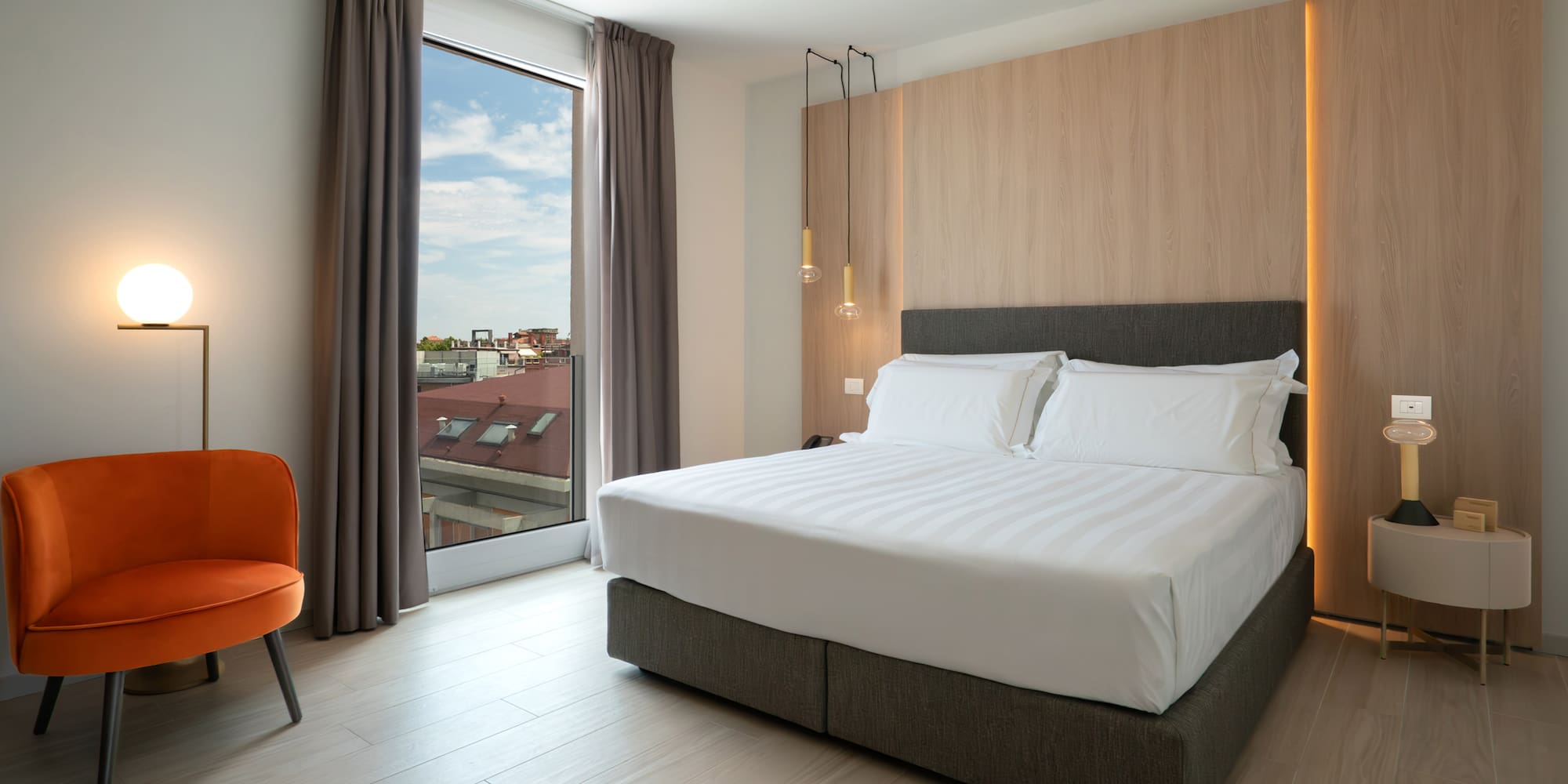 a room with a bed and a chair