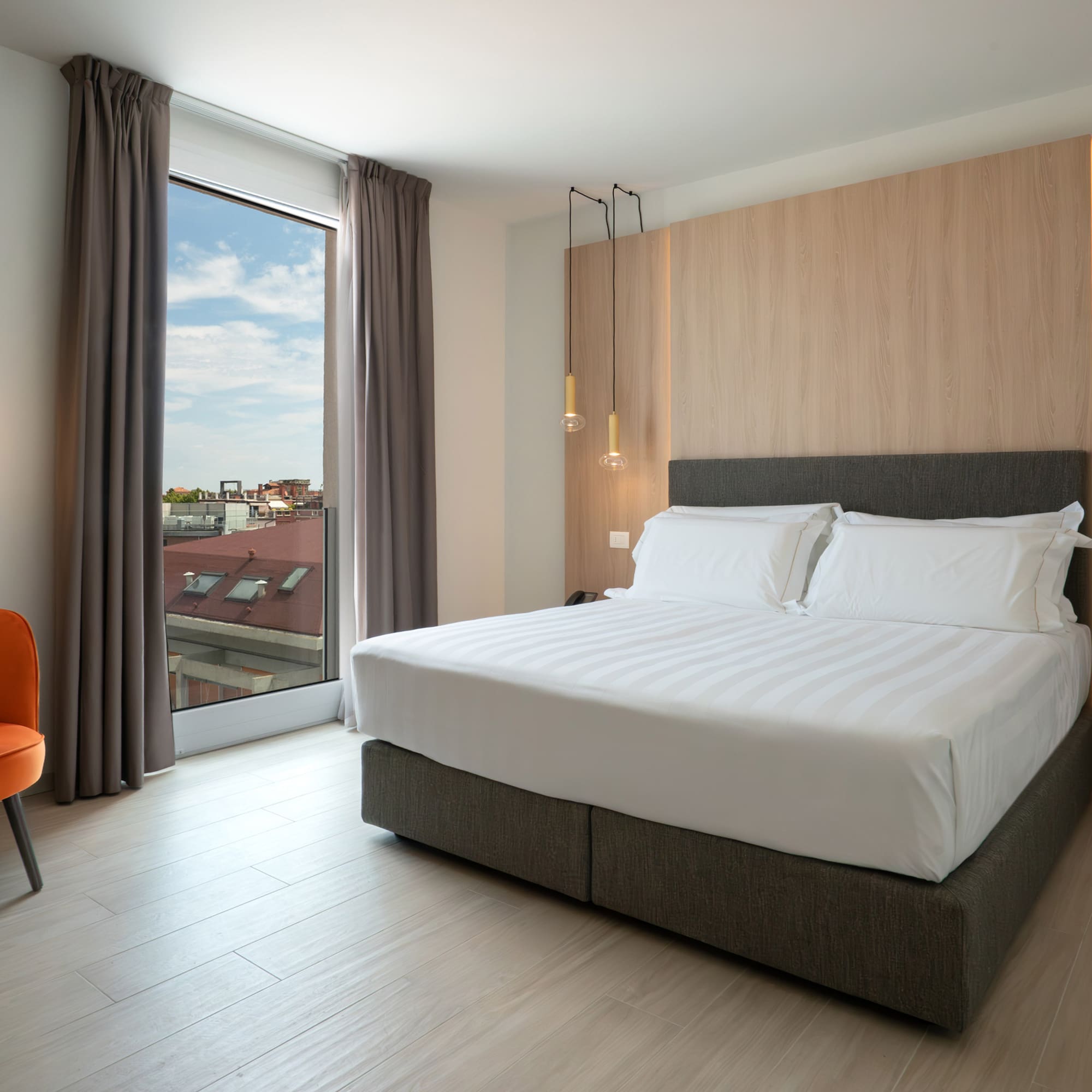 a room with a bed and a chair