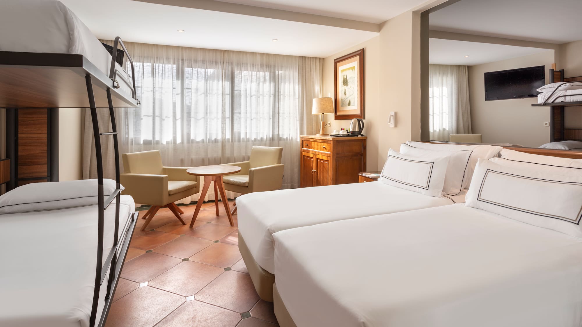 a room with a bed and a television