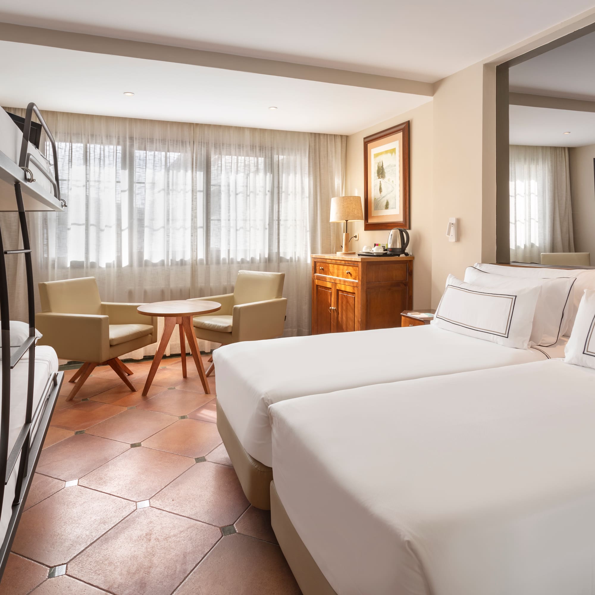 a room with a bed and a television