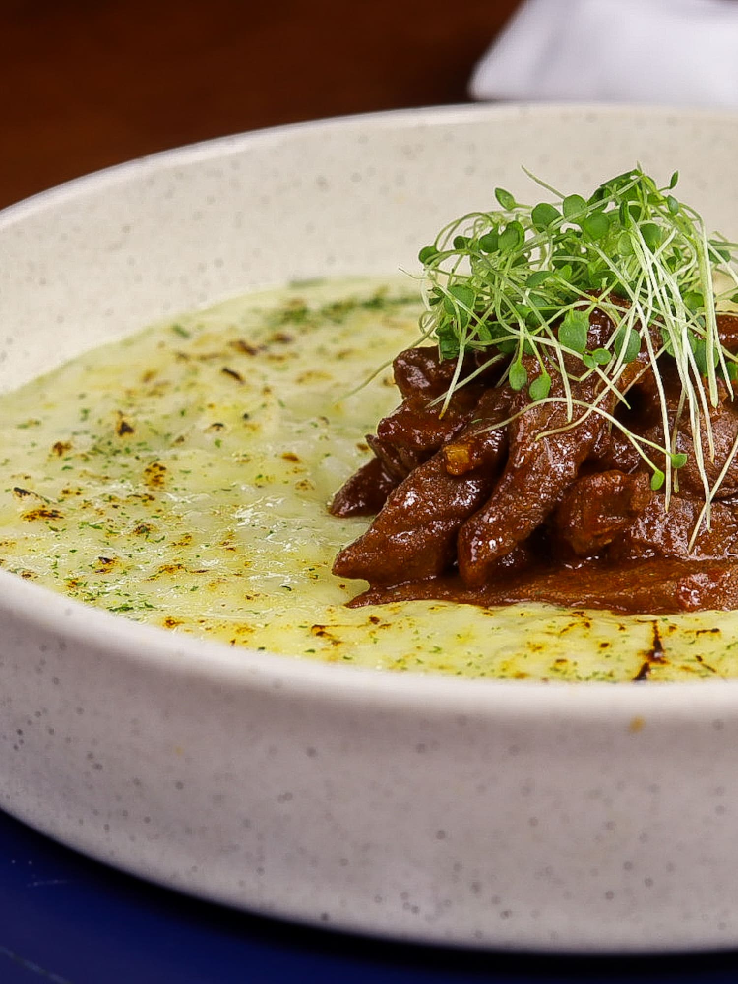 a bowl of food with sprouts