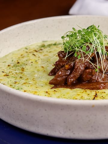 a bowl of food with sprouts