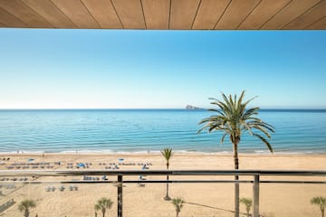 a view of a beach from a balcony
