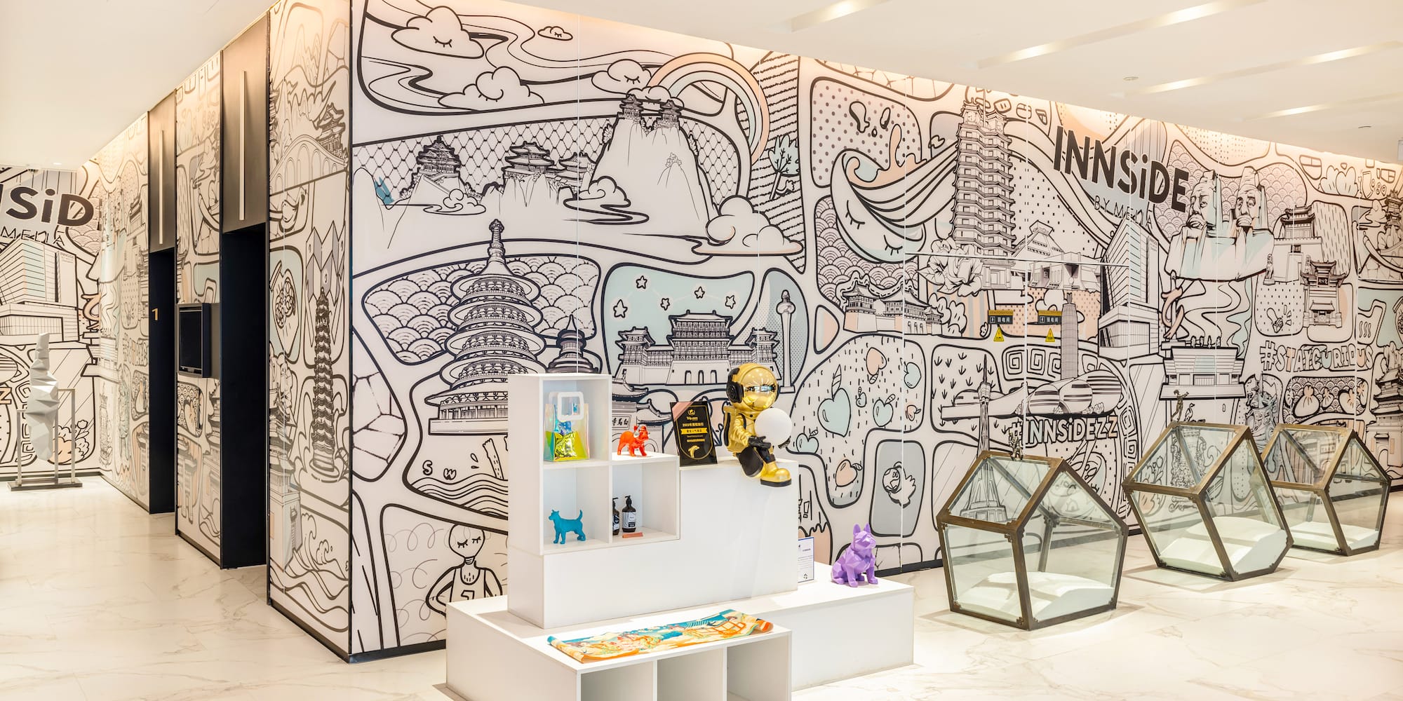 a room with a wall with a drawing of a cartoon character