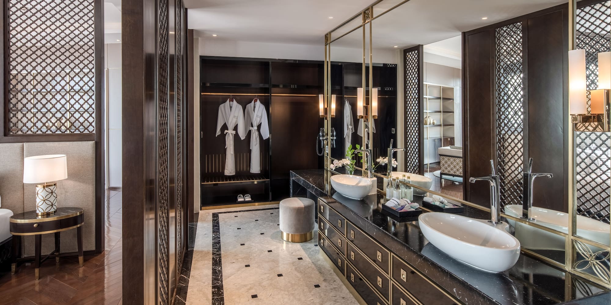 a bathroom with a large mirror and sinks