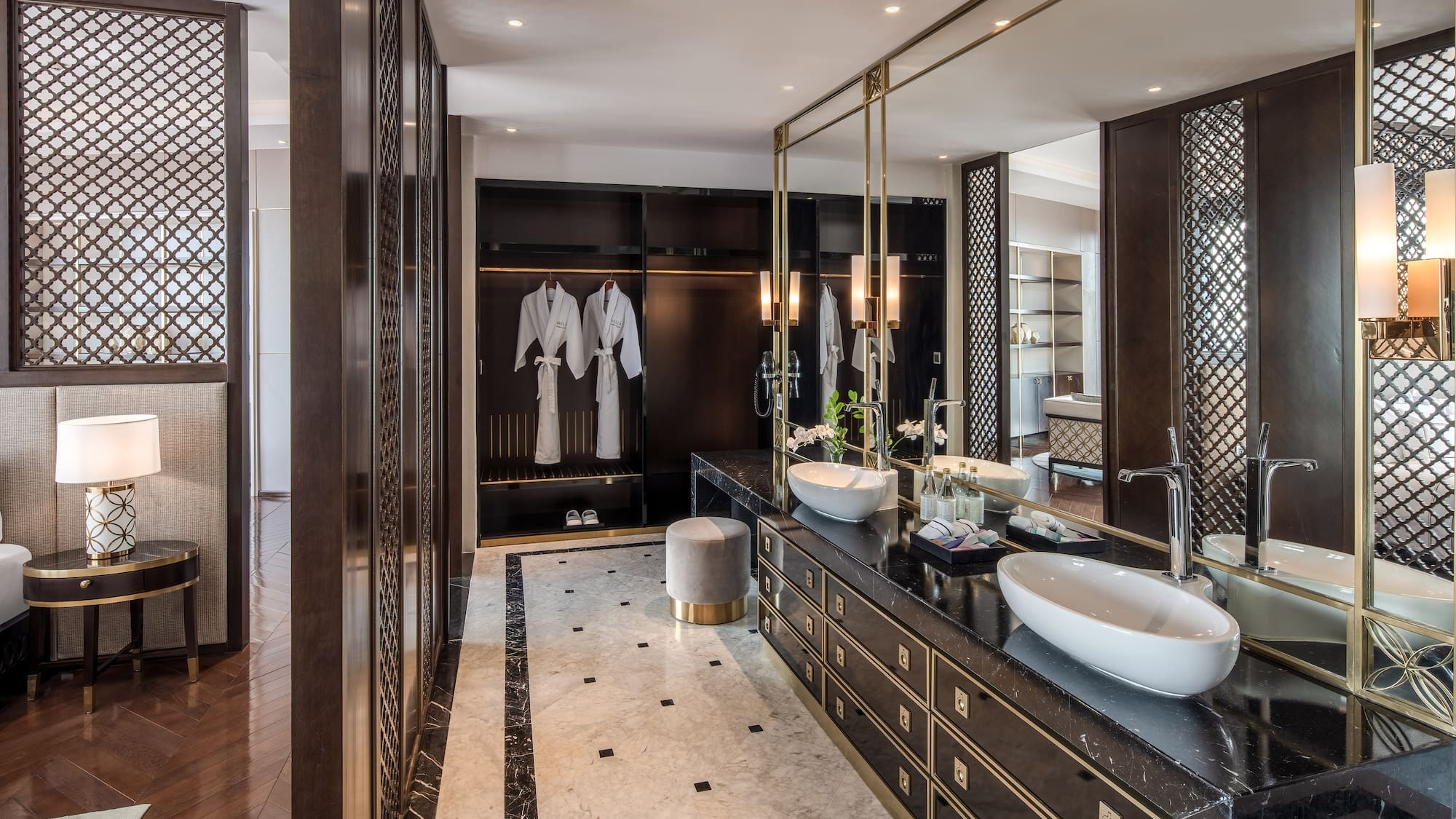 a bathroom with a large mirror and sinks