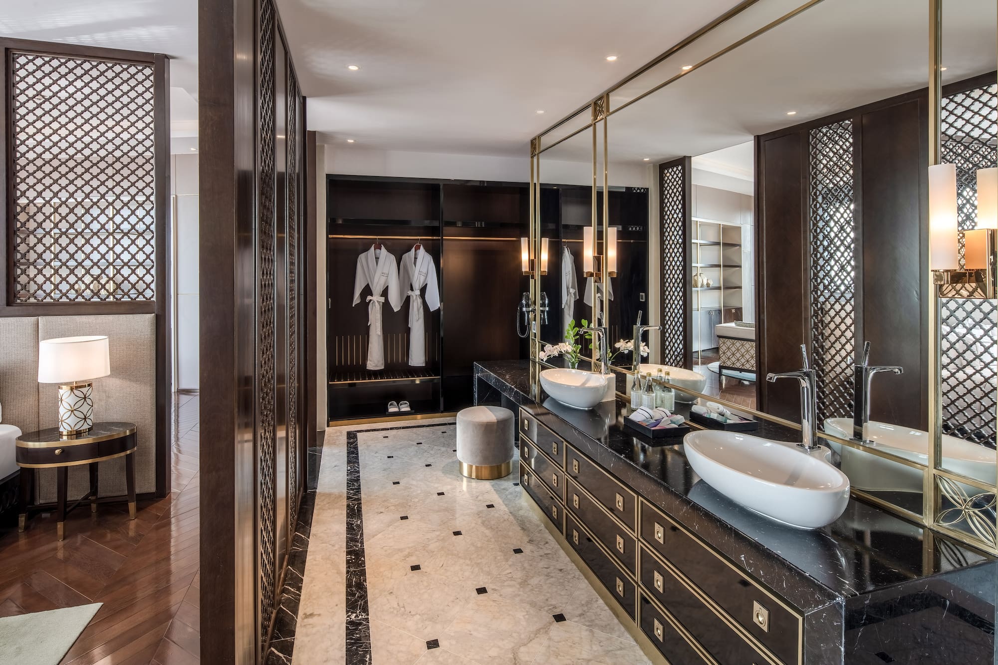 a bathroom with a large mirror and sinks