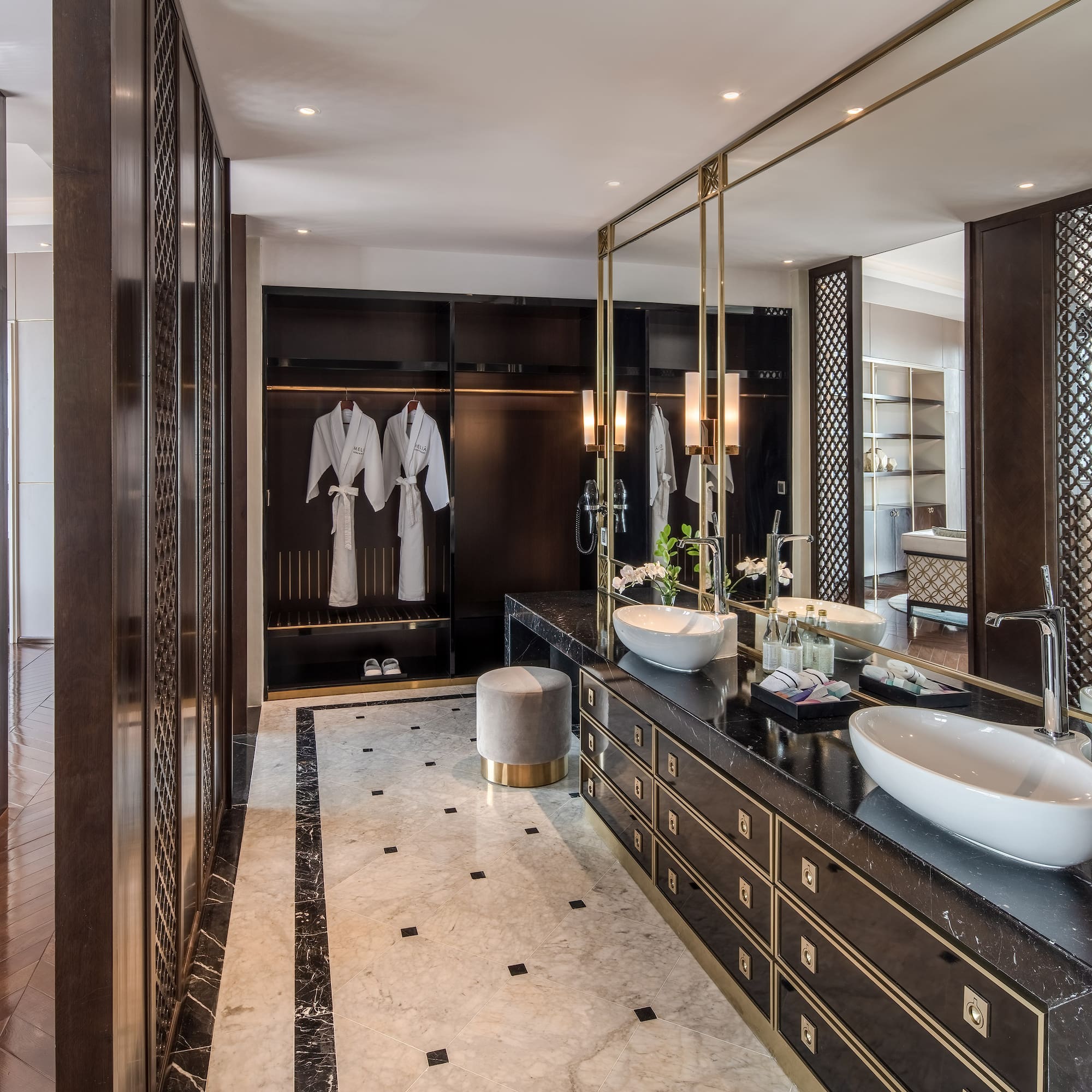 a bathroom with a large mirror and sinks