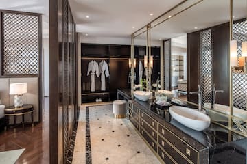 a bathroom with a large mirror and sinks