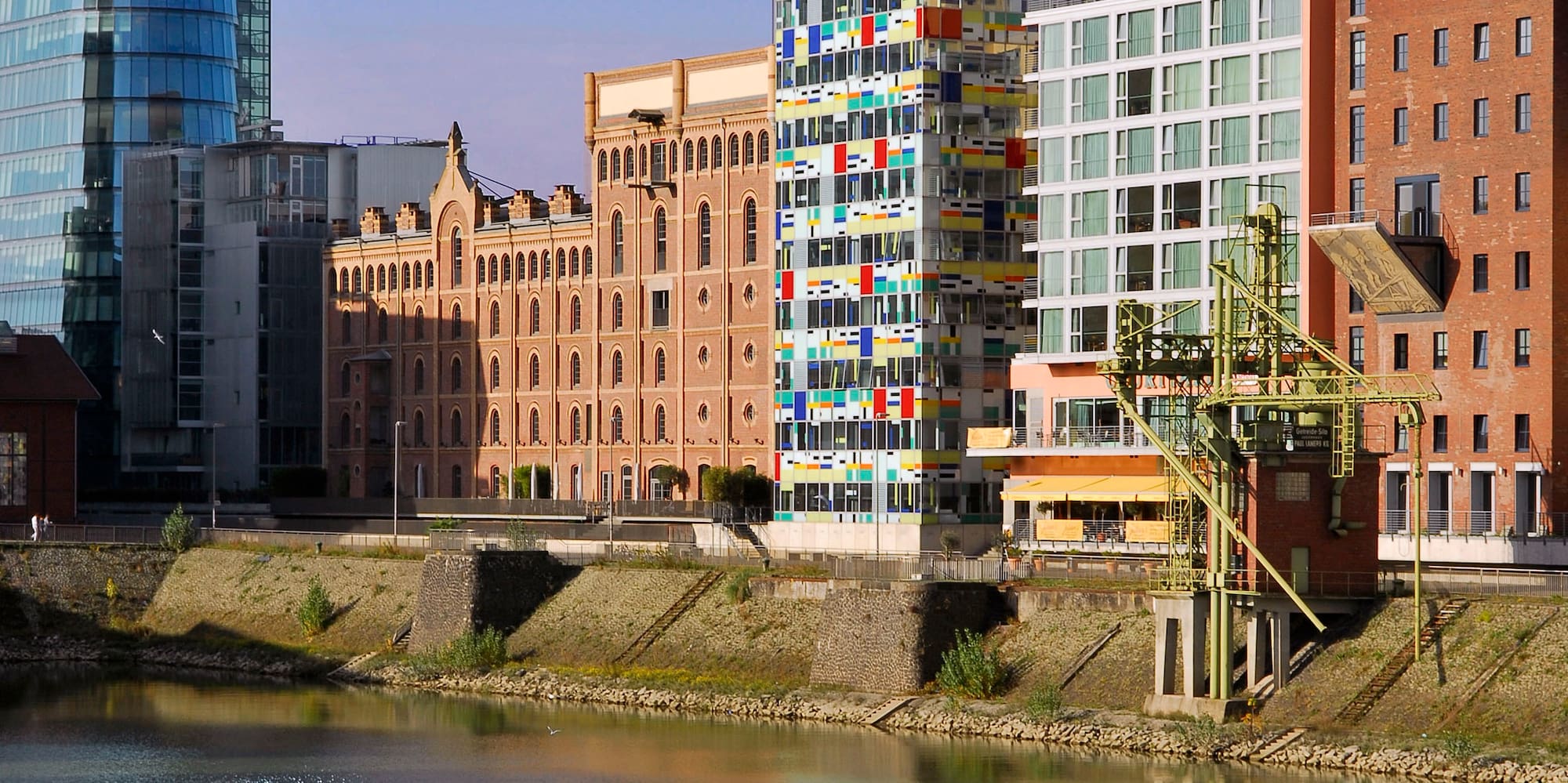a body of water with buildings in the background