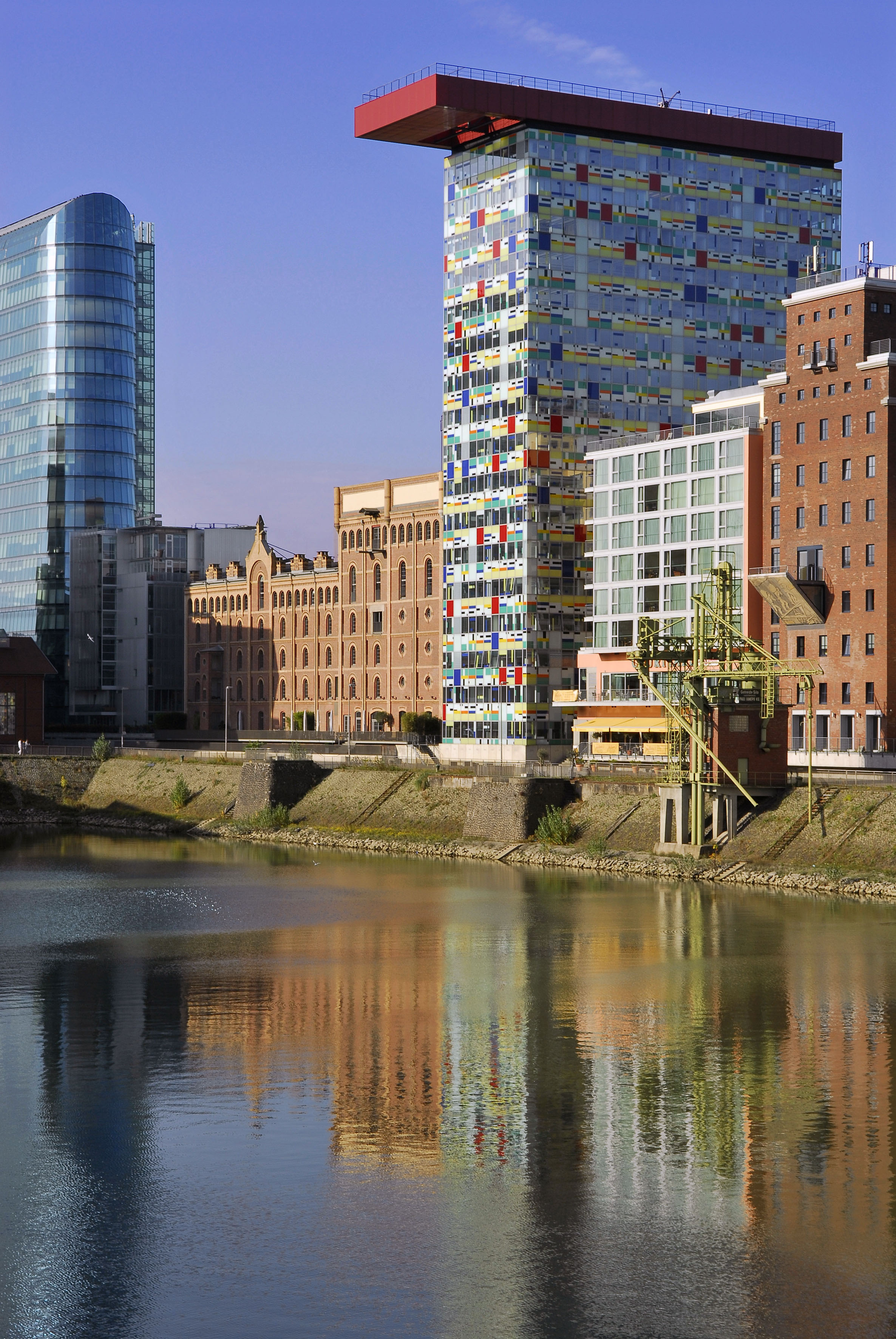 a body of water with buildings in the background