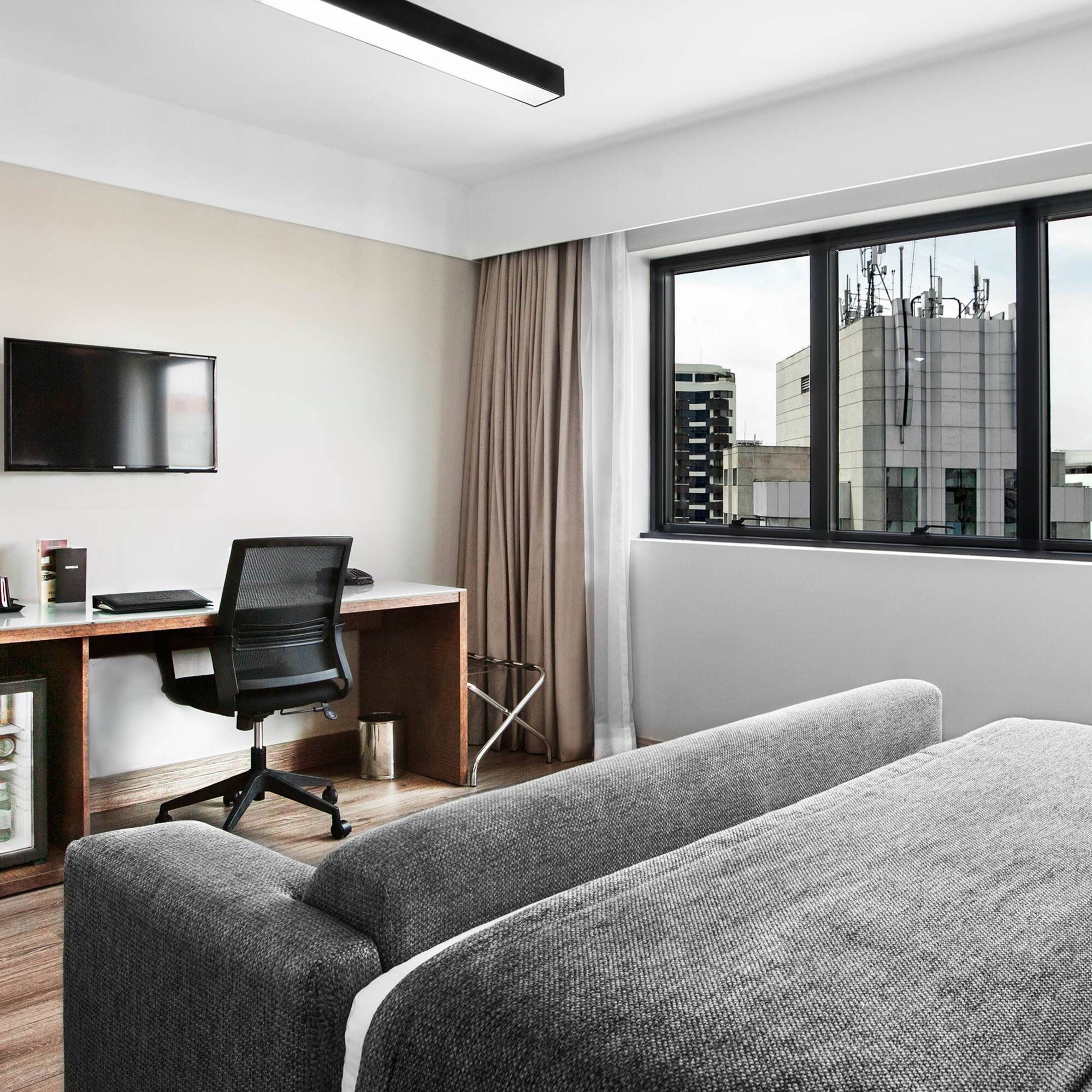 a room with a couch and a desk