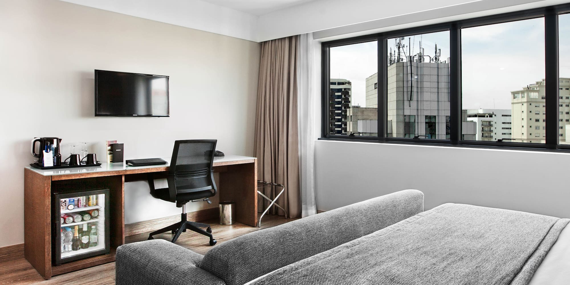 a room with a couch and a desk