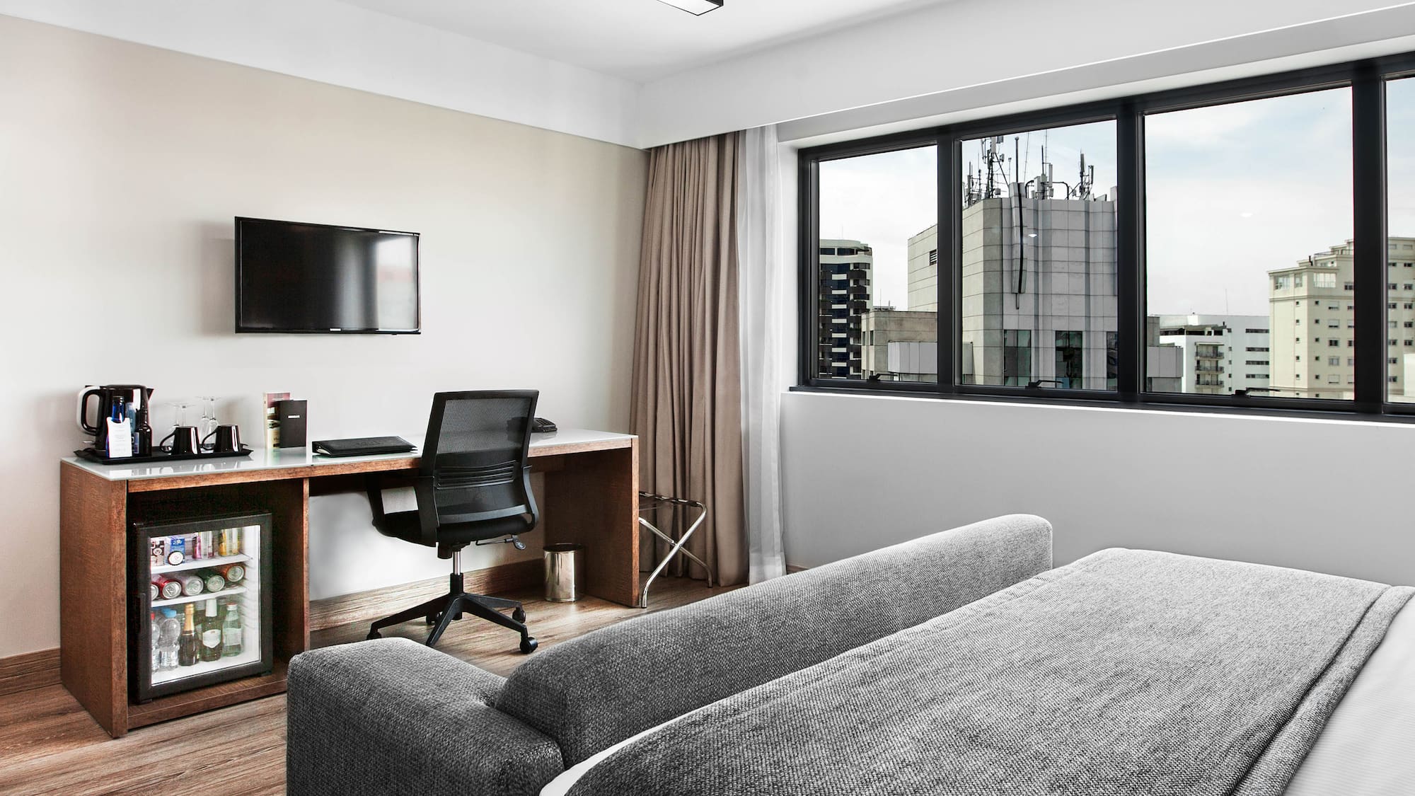 a room with a couch and a desk