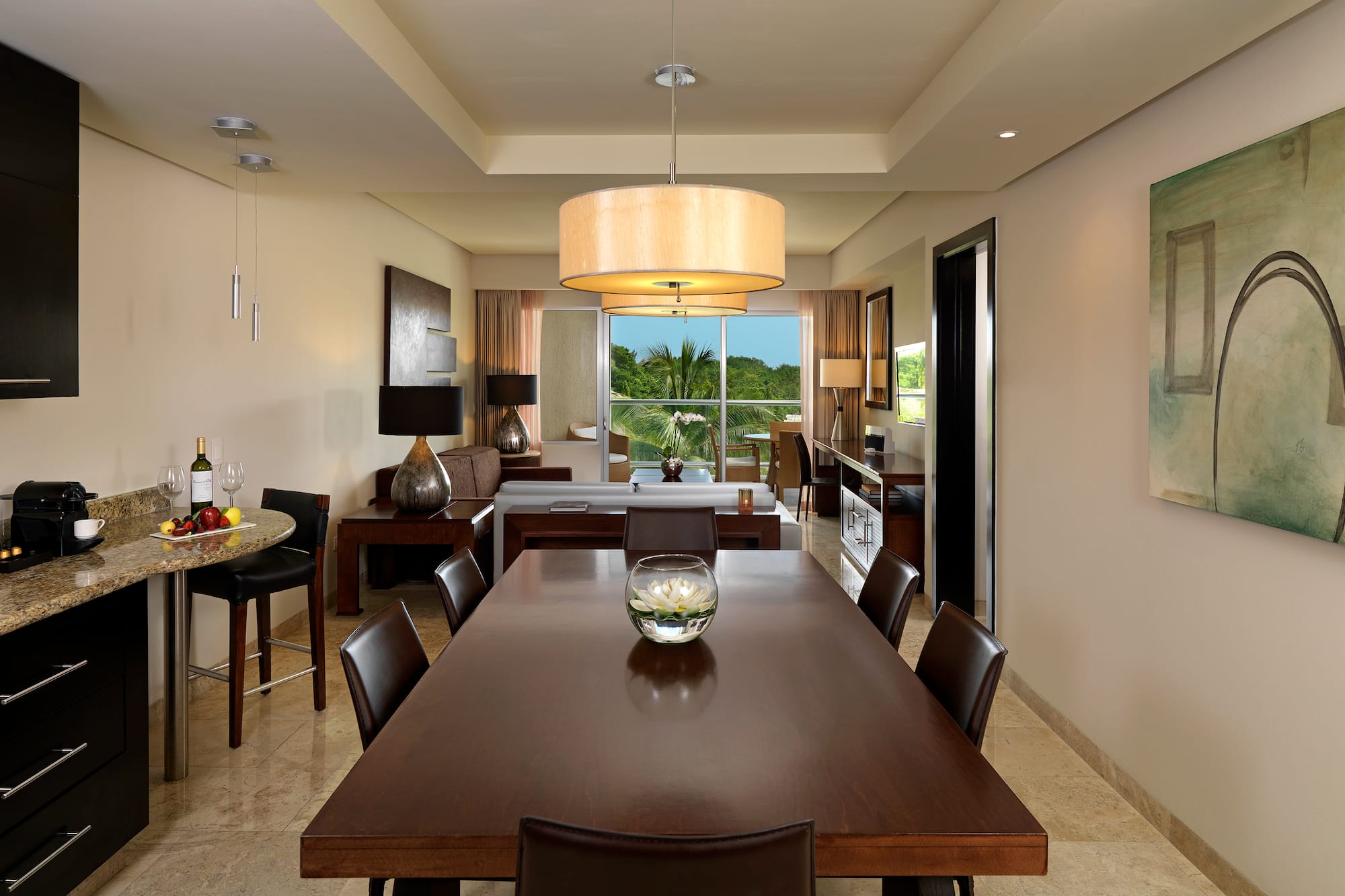 a dining room with a table and chairs