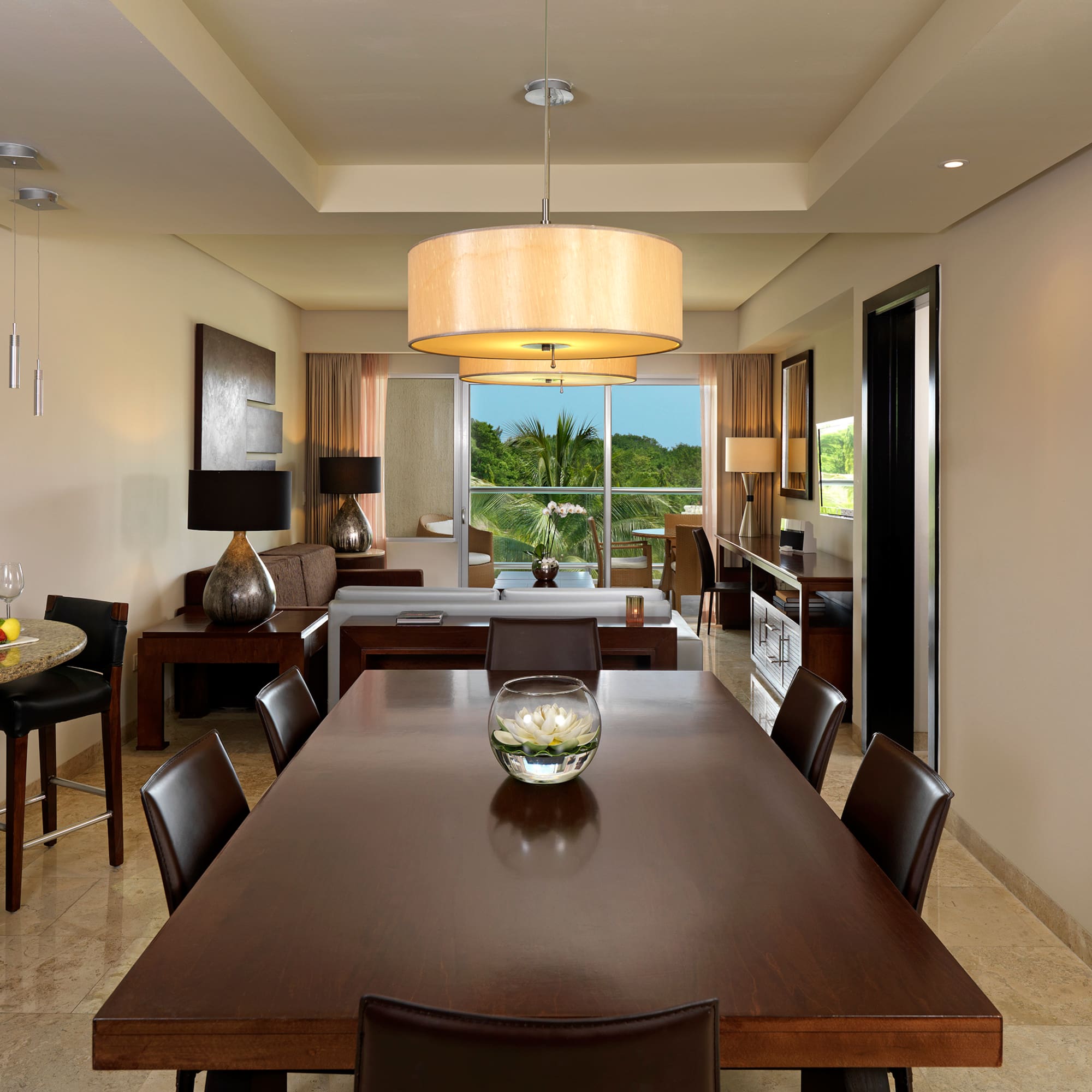 a dining room with a table and chairs