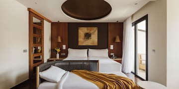 a bedroom with a bed and a table