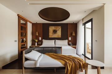 a bedroom with a bed and a table