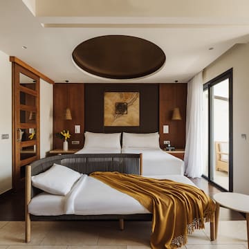 a bedroom with a bed and a table