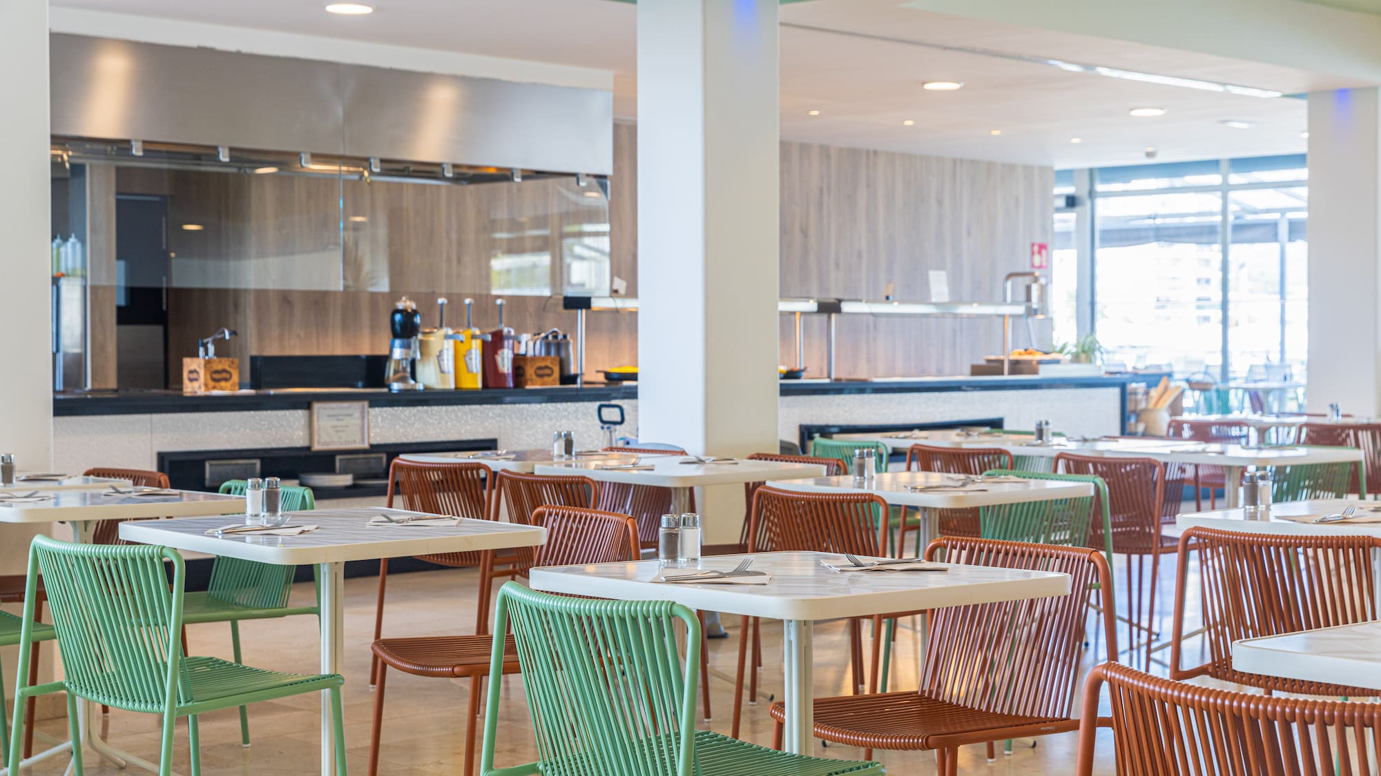 a restaurant with tables and chairs