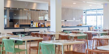 a restaurant with tables and chairs