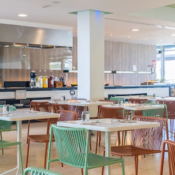 a restaurant with tables and chairs