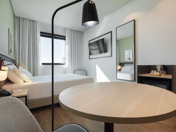 a room with a table and chairs