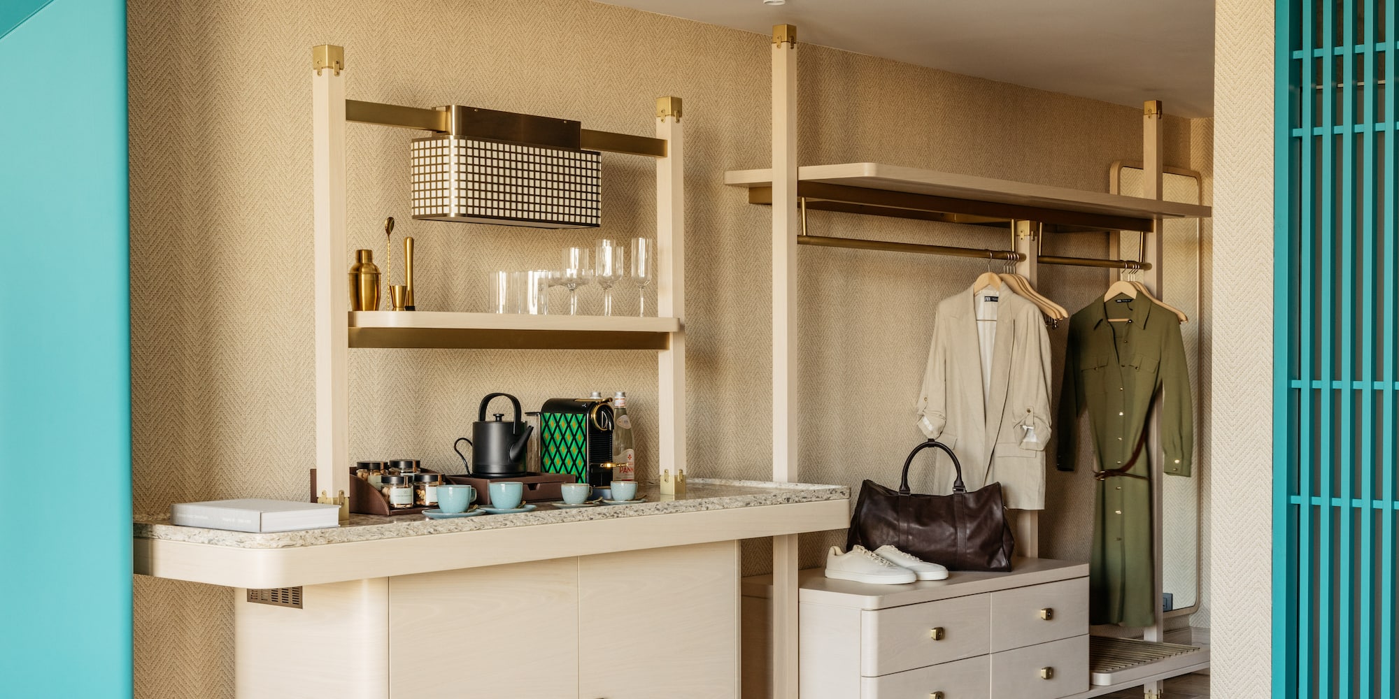 a room with a counter and shelves and a coat rack