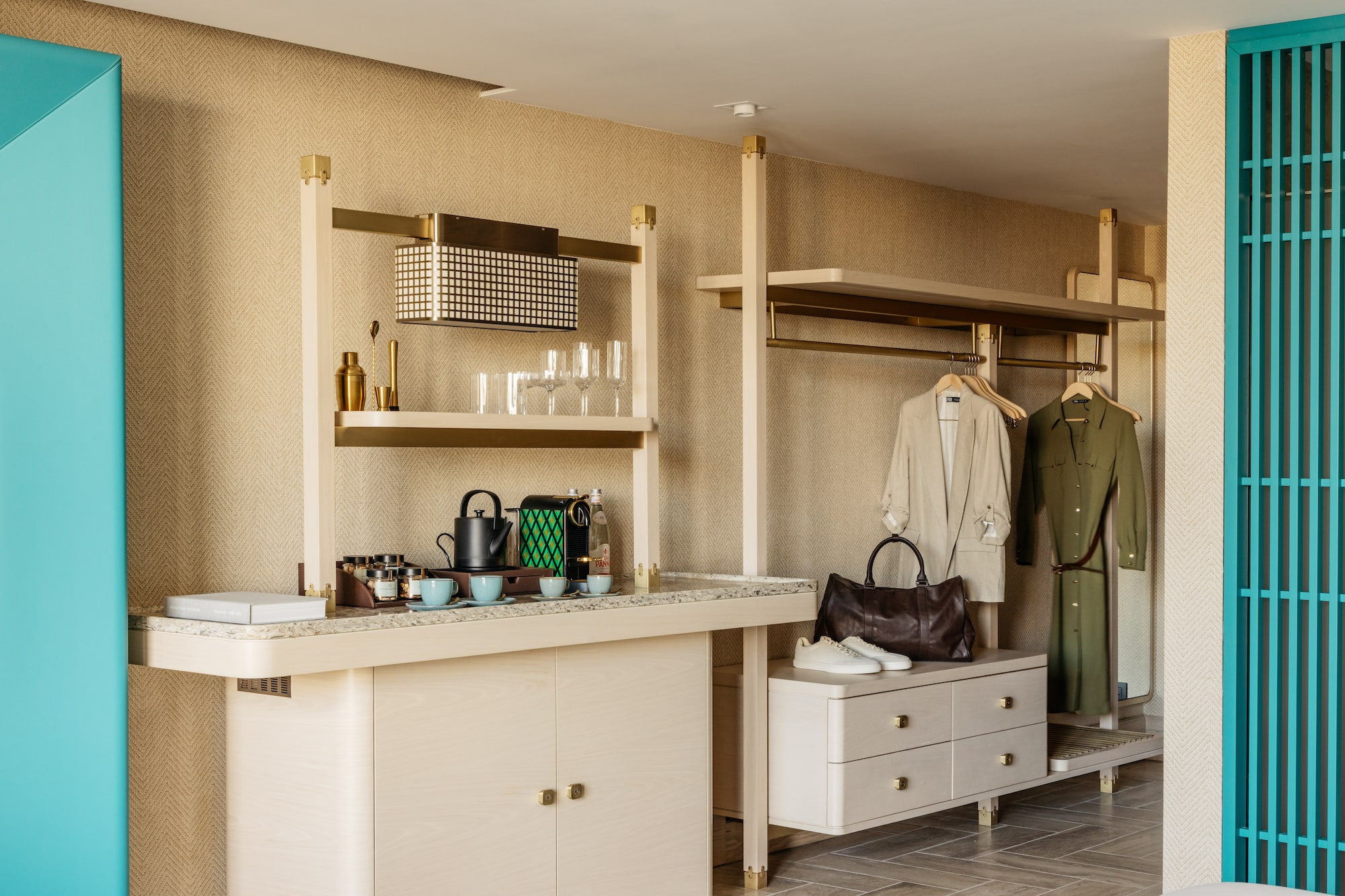 a room with a counter and shelves and a coat rack